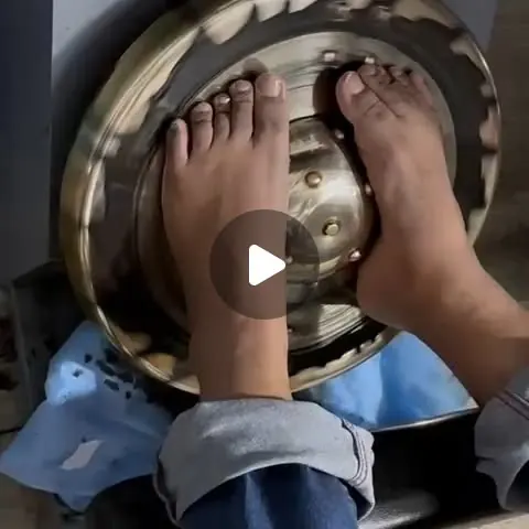 Feet resting on a bronze Kansa thali